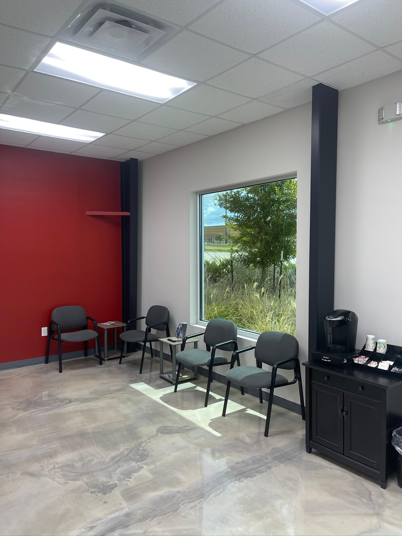 Fort Worth commercial painting project - waiting area with red accent wall